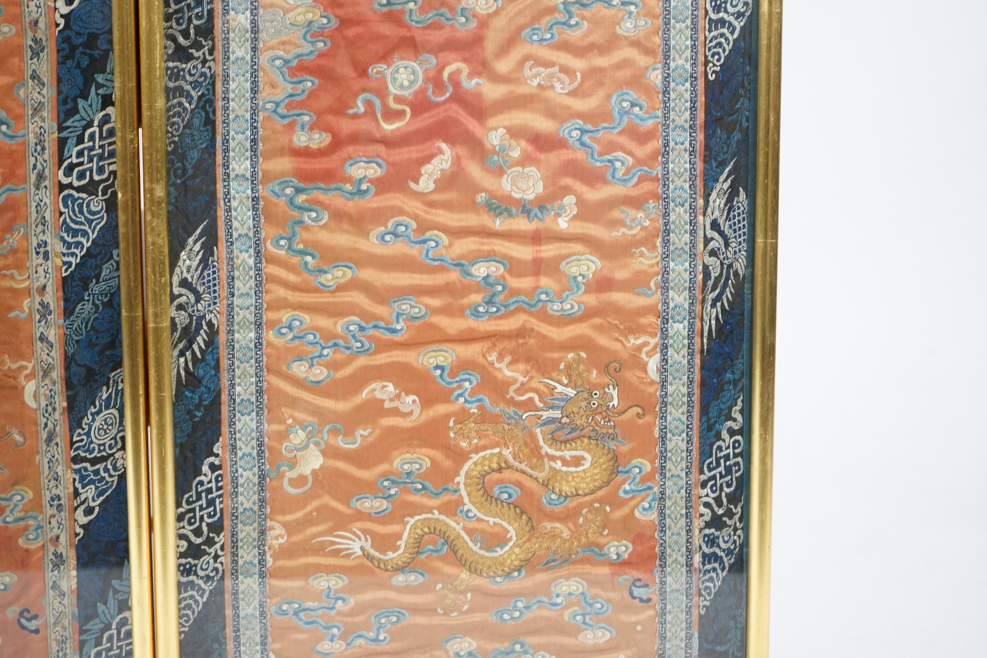 A pair of Chinese coral silk ‘dragon’ panels, 19th century